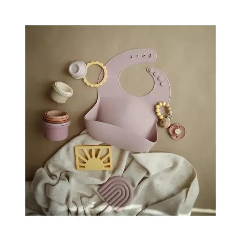mushie__babete_de_beb_de__SKU7Cg0E5pW_1.webp Mushie - Babete de bebê de silicone - Malva claro Fashion
