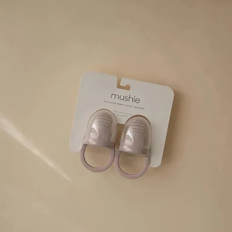 mushie__chupeta_alimentad_SKUicgCtJlq_1.webp Mushie - Chupeta alimentadora de alimentos e frutas frescas para bebê de silicone 2Pk, lilás macio Sale