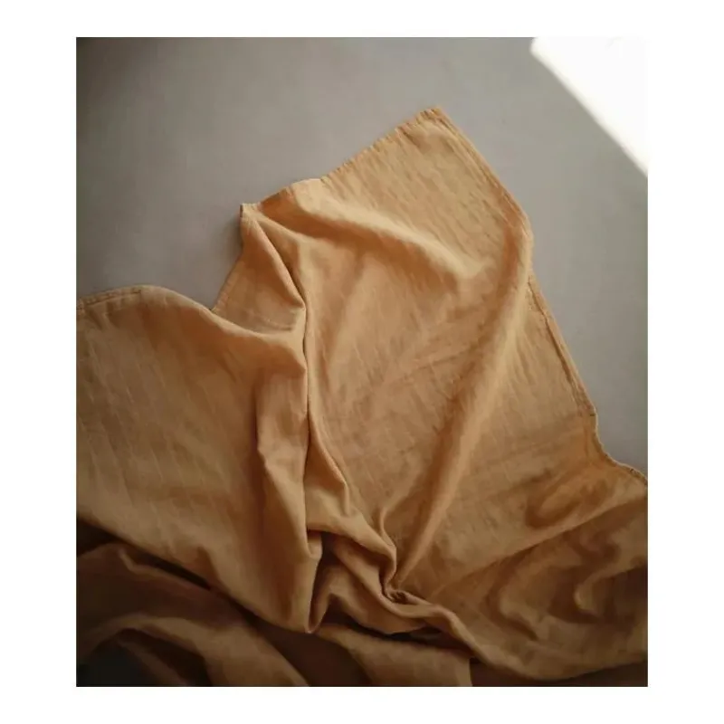 mushie__cobertor_de_musse_SKUN2L1ROu5_2.webp Mushie - Cobertor de musselina - Amarelo Outono Sale